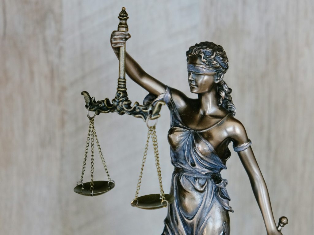 Photo of Lady Justice as Anthropic investigates Claude in a research paper on the values of AI models and how they judge when involving complex human principles and ethics.